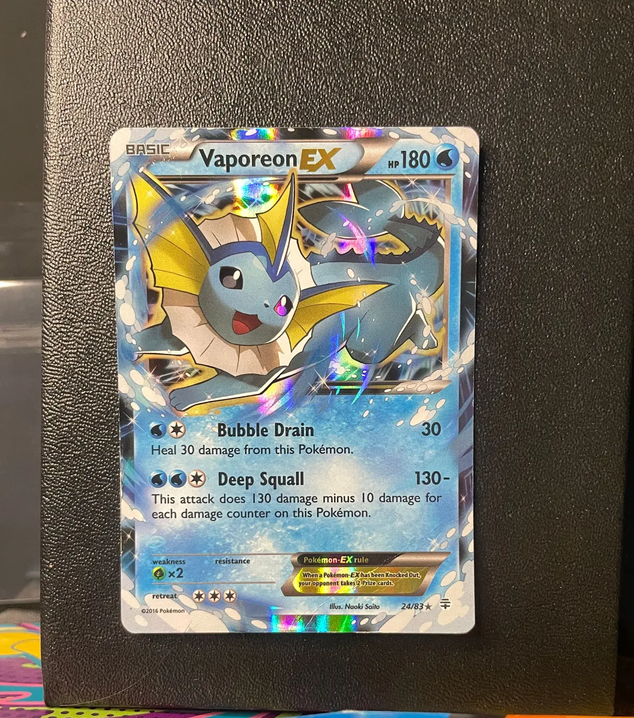 Vaporeon EX 24/83 - Frente